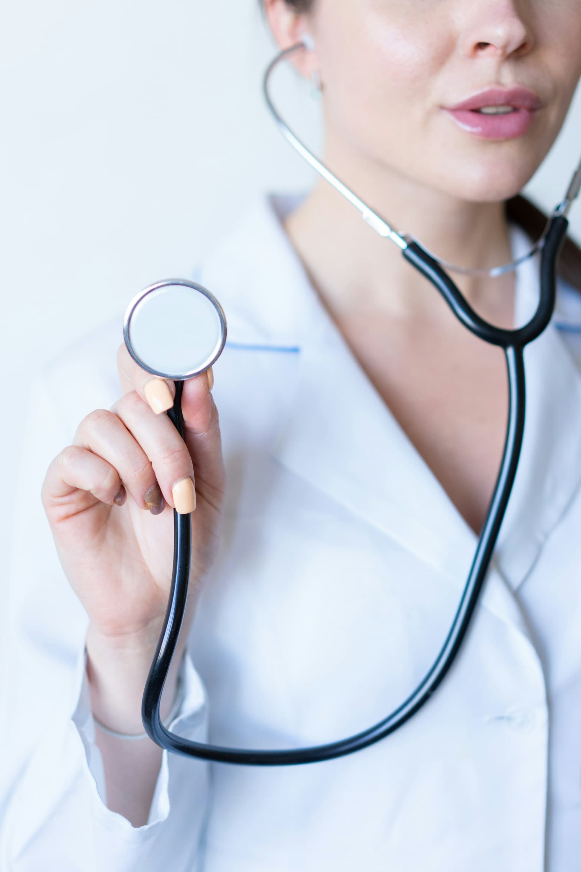 Healthcare professional holding a stethoscope